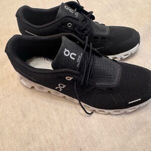 On CloudWomen's Black Running Shoe